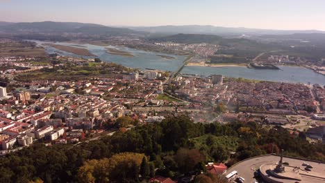 Viana-Do-Castelo-cityscape-with-Basilica-Santa-Luzia-on-hilltop,-aerial-drone-shot
