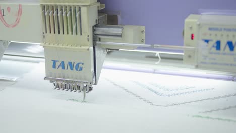 Close-up-shot-of-Indian-Sewing-Machine-with-fast-stitching-movement-inside-the-factory