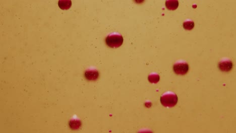 Rosafarbene-Tintenblasen-Versinken-Langsam-Im-Öl,-Nahaufnahme-Einer-Statischen-Aufnahme
