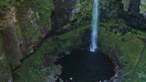Aerial-view-of-Amidaga-Taki-Falls,-mossy-and-lichen-covered-cliffs-from-above