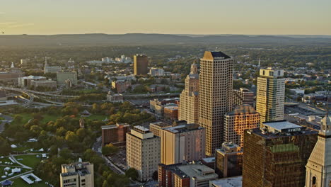 Hartford-Connecticut-Aerial-v10-drone-fly-around-downtown-capturing-spectacular-cityscape-with-shimmering-sunset-reflection-on-high-rise-glass-windows---Shot-with-Inspire-2,-X7-camera---October-2021