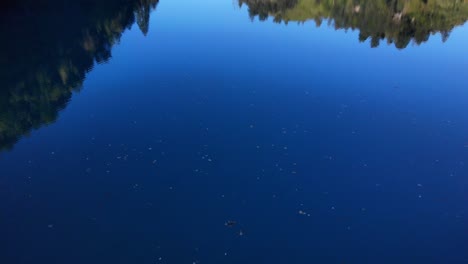 Calm-Klammsee-Lake-With-Reflections-Near-Kaprun,-Austria---aerial-static