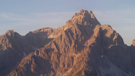 Panorama-pan-shot-of-Punta-Tre-Scarperi,-Schwalbenkofel-and-Haunold-Mountain-Peak-during-sunset-in-Sesto-Dolomites
