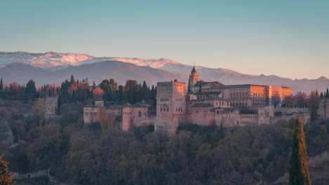 Alhambra-and-Snowy-Sierra-Nevada-day-to-night-time-lapse-in-Granada,-Andalusia,-Spain