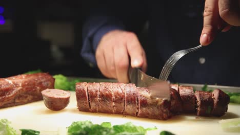 Man-cutting-beef-in-restaurant