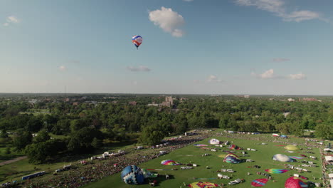 Aerial-shot-following-hot-air-balloon-in-Great-Forest-Park-Balloon-Race