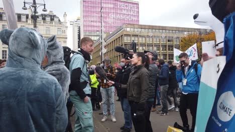 A-protester-getting-interviewed-with-a-tv-crew-in-George-Square
