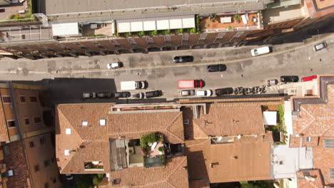 Narrow-streets-and-building-yards-of-Bologna-city,-low-altitude-aerial-top-down-view