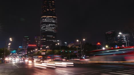 Seoul-city-night-street-timelapse---cars-traffic-on-crossroads-near-Lotte-World-Tower-Mall