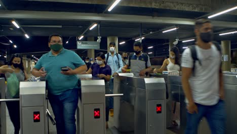 Passengers-swipe-their-fare-cards-at-the-turnstile-to-enter-the-metro-station---time-lapse