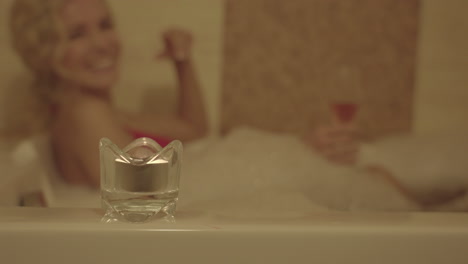 Happy-Woman-in-Bubble-Bath,-Relaxation-Treatment-in-Wellness-Spa-Center,-Selective-Focus,-Slow-Motion