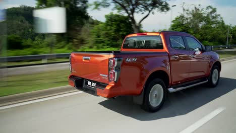 Malaysia,-March-13,-2022:-4x4-Isuzu-D-Max-pick-up-truck-driving-fast-on-the-toll-road