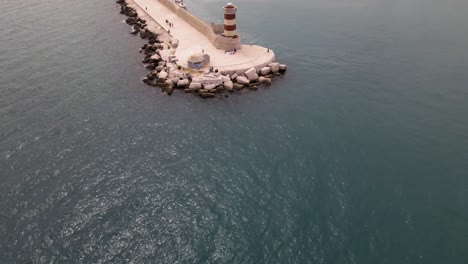 Aerial-drone-tilt-up-revealing-beautiful-Monopoli-from-a-lighthouse