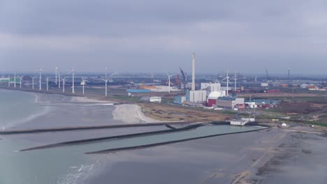 Aerial-over-ocean-view-of-Borssele-Nuclear-Power-Station,-Netherlands