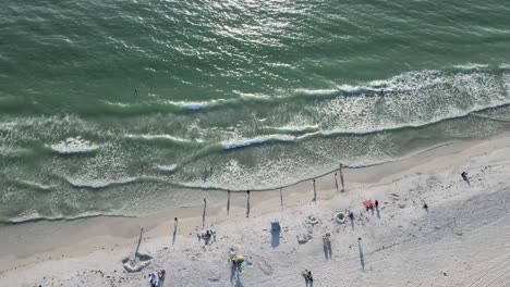 waves,-sun-and-fun-during-sundown-on-Cortez-Beach-in-Bradenton,-Florida-in-the-aerial-drone-view