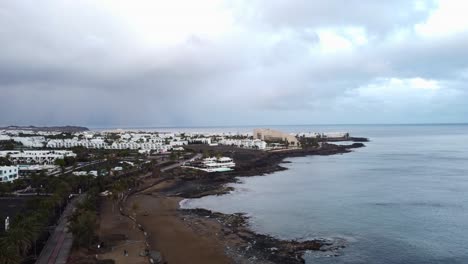 Drone-shot-of-Costa-Teguise-and-Playa-Bastian-beach-on-Lanzarote-coast