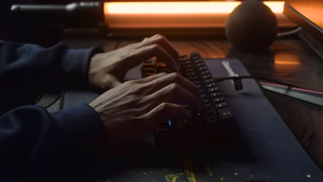 Typing-on-RGB-gaming-keyboard.-desktop-gaming-computer