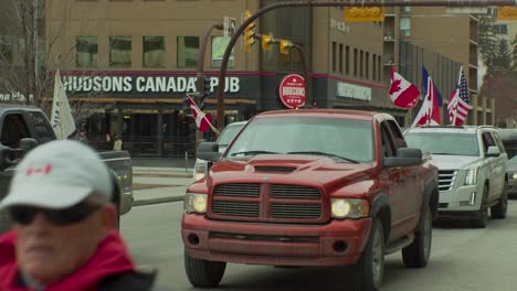 Cars-trucks-with-flags-Calgary-Protest-slow-mo-5th-Feb-2022