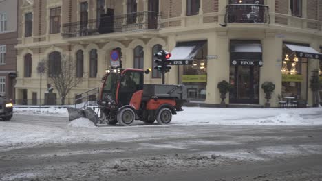 Winter-Service-Vehicle-Clearing-The-Snow-In-The-Street-At-Winter-In-Oslo,-Norway