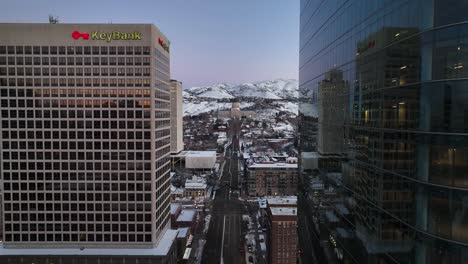 Beautiful-Aerial-in-Between-Buildings-at-Sunrise-in-Downtown-Salt-Lake-City-Utah---Forward-Movement