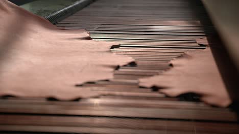 Leather-Hides-Being-Removed-From-A-Machine-During-Manufacturing