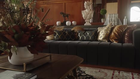 Retro-black-couch-in-a-1900's-mansion-living-room