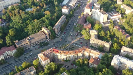 Aerial-drone-video-of-downtown-apartment-buildings-and-cars-on-the-highway-in-Pecherskyi-district-of-Kyiv-Oblast-Ukraine-during-sunset