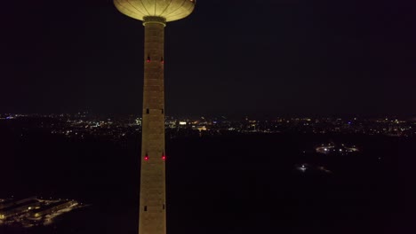 AERIAL:-Yellow-Lights-Shines-on-Vilnius-TV-Tower-on-Day-of-Re-establishment-of-the-State-of-Lithuania