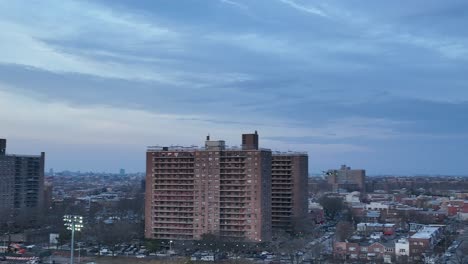 An-aerial-view-over-Calvert-Vaux-Park-in-Brooklyn,-NY-during-a-cloudy-evening