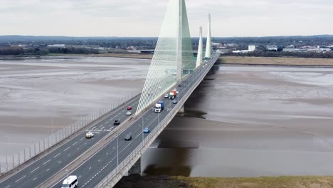 Mersey-gateway-landmark-aerial-view-above-toll-suspension-bridge-river-crossing-jib-up-shot