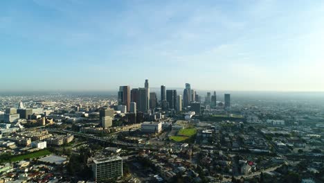 Rising-aerial-view-of-LA's-skyscrapers-from-the-north-end-of-the-city,-circa-2018