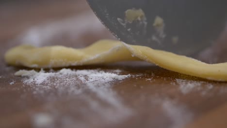 Pizza-Cutter-Rolling-And-Cutting-Faworki-Dough-With-Flour