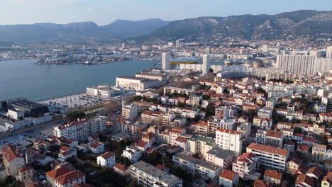 Toulon-City-and-Port-at-French-Riviera,-Sunny-Aerial-Establishing-View