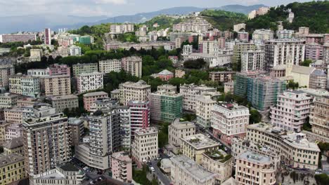 Urban-Hillside-Buildings-in-Popular-Italy-City-of-Genova---Aerial-Panning