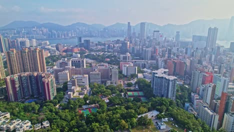 A-dynamic-aerial-footage-of-the-cityscape-of-Mong-Kok-area-in-Kowloon,-Hong-Kong