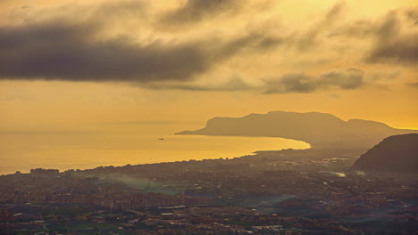Elevated-golden-hour-time-lapse-towards-sea-over-Palermo,-Sicily,-Italy