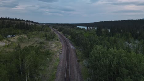 Empty-train-track-running-through-the-stunning-landscapes-of-Kananaskis-Country-in-Alberta,-Canada