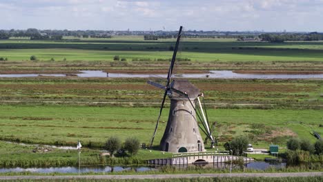 Aerial-parallax-shot-of-typical-iconic-Dutch-windmill-in-Haastrecht