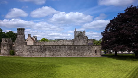 Motion-time-lapse-of-Boyle-Abbey-medieval-ruin-in-county-Roscommon-in-Ireland-as-a-historical-sightseeing-landmark-with-dramatic-clouds-in-the-sky-on-a-summer-day