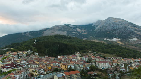 Timelapse-of-a-cloudy-mountain-landscape-in-a-little-town-in-South-Italy-at-dusk