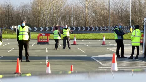Covid-medical-staff-working-on-public-test-centre-car-park-during-healthcare-crisis