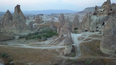 Mushroom-shaped-fairy-chimneys-in-Red-Valley,-Cappadocia,-Turkey