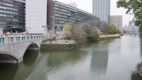 Tokyo-City,-Building-contrasted-by-ancient-imperial-Moat