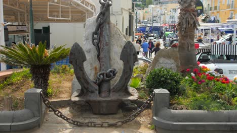 Close-up-shot-of-a-black-anchor-by-the-roadside-in-Marina-Grande-port-on-Capri-Island,-Naples,-Italy-at-daytime
