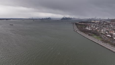 A-high-angle,-aerial-view-over-the-waters-of-Upper-Bay-in-Brooklyn-NY