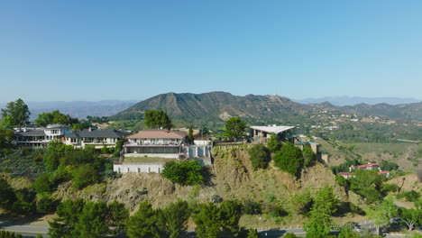 Aerial-Luxury-Real-Estate,-Drone-Shot-of-Hollywood-Hills-Homes-on-Beautiful-Sunny-California-Day