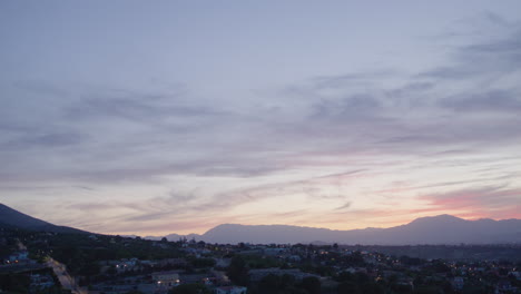 Peaceful-sunset-or-sunrise-in-a-neighbourhood-with-mountain-background