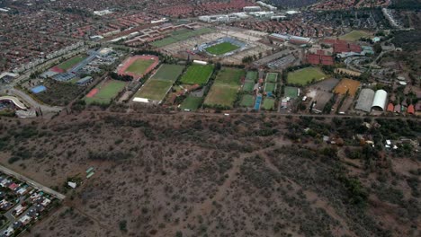 Aerial-view-dolly-in-tilt-down-of-the-San-Carlos-de-Apoquindo-Stadium,-home-of-the-Universidad-Catolica-team,-Santiago,-Chile