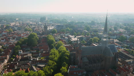 Neo-Gothic-Basilica-Of-Gouwekerk-And-Distant-View-Of-Sint-Jan-Church-In-The-Heart-Of-Gouda-Municipality,-Netherlands