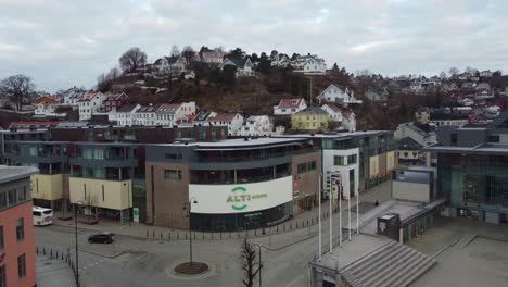 Alti-Shopping-center-Arendal-Norway---Ascending-aerial-showing-main-entrance-and-logo-of-mall-in-Vestervei-street